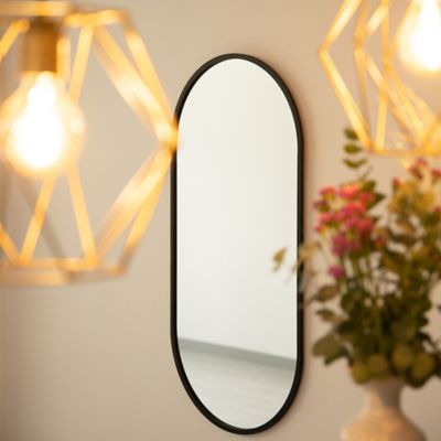 Espejo con forma ovalada para pared y sin marco de medidas 50x100 cm  fabricado con vidrio